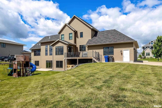 5541 Pigeon Creek Rd, Bettendorf, IA 52722 - back of property with a lawn, a wooden deck, and a shingled roof