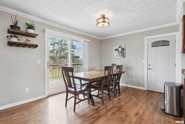 3770 153rd St, Blue Grass, IA 52726 - dining room featuring wood finished floors and crown molding