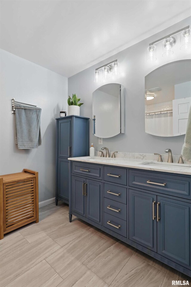 3770 153rd St, Blue Grass, IA 52726 - bathroom with double vanity and baseboards