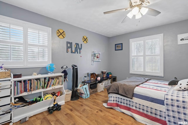 3770 153rd St, Blue Grass, IA 52726 - bedroom featuring wood finished floors and ceiling fan
