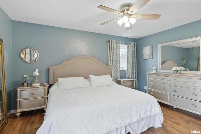 3770 153rd St, Blue Grass, IA 52726 - bedroom featuring wood finished floors and ceiling fan