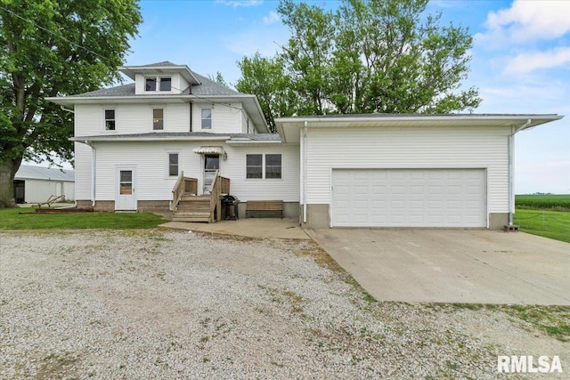 3292 110th St, Stockton, IA 52769 - view of front facade with driveway and a garage