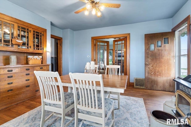 3292 110th St, Stockton, IA 52769 - dining room with a ceiling fan and wood finished floors