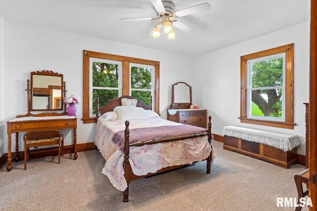 3292 110th St, Stockton, IA 52769 - bedroom with carpet flooring and ceiling fan