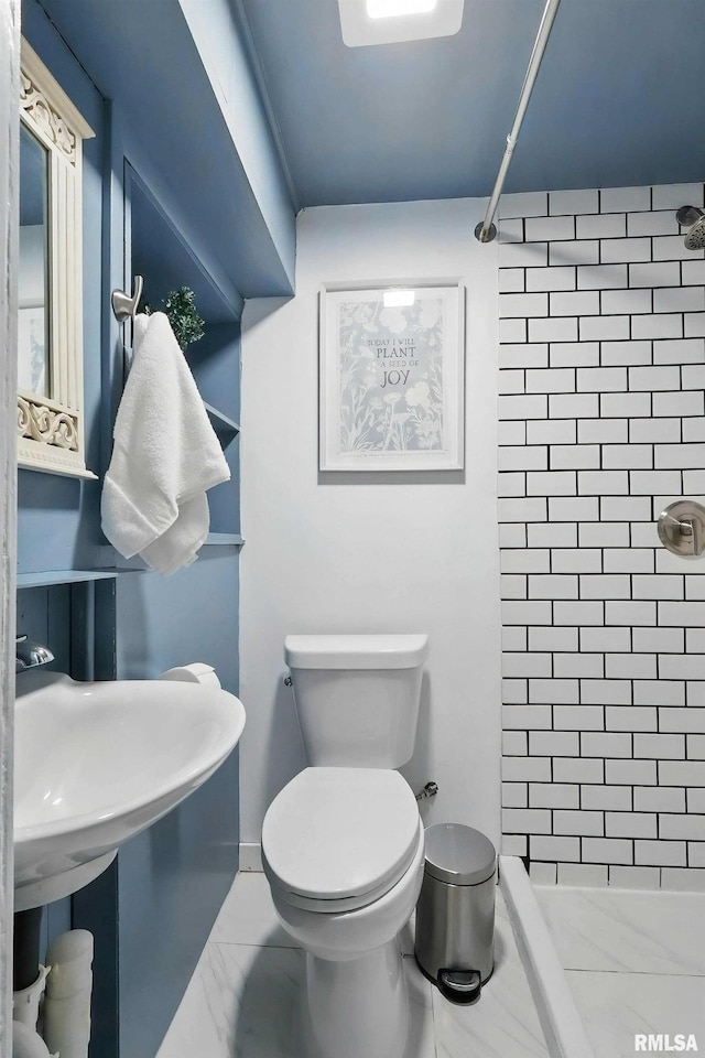 3123 Commodore St, Davenport, IA 52802 - bathroom featuring a shower stall and marble finish flooring