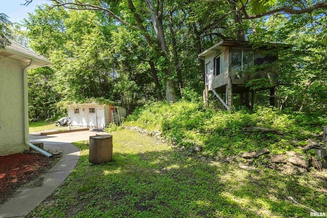 3123 Commodore St, Davenport, IA 52802 - view of yard with an outdoor structure and a sunroom