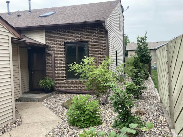 1862 53rd St, Moline, IL 61265 - view of property exterior featuring brick siding and roof with shingles