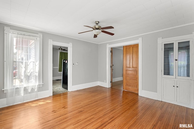117 W 14th St, Davenport, IA 52803 - spare room with ceiling fan, crown molding, hardwood / wood-style floors, and healthy amount of natural light