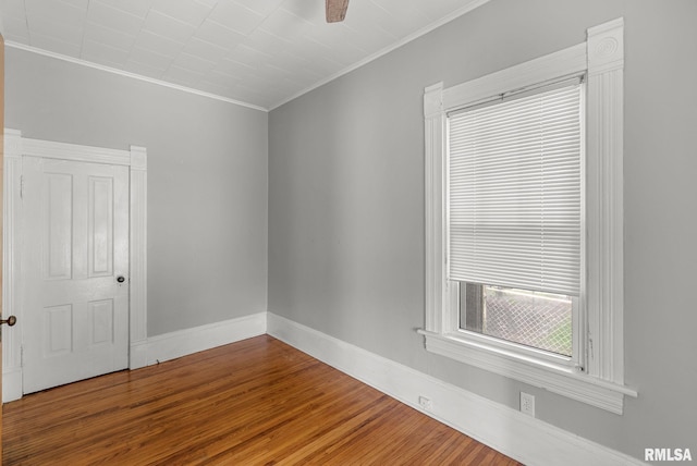 117 W 14th St, Davenport, IA 52803 - spare room featuring crown molding, wood finished floors, and ceiling fan
