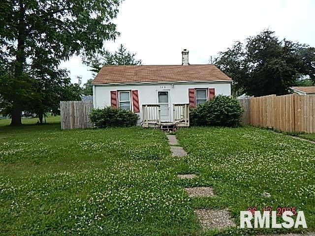 708 3rd St, Buffalo, IA 52728 - rear view of house featuring a chimney