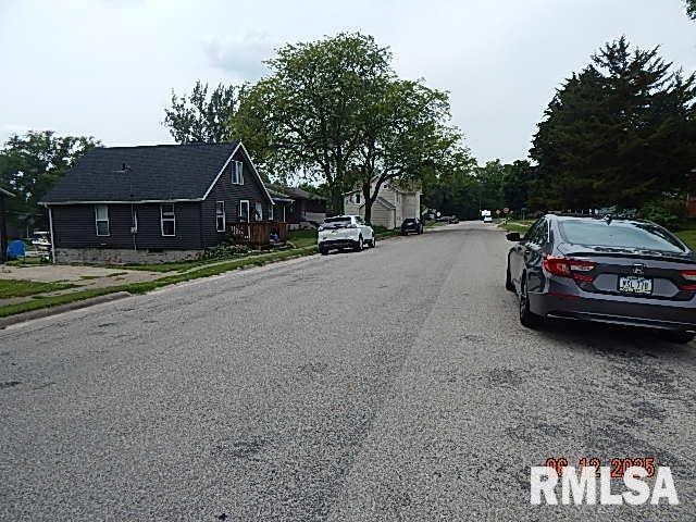 708 3rd St, Buffalo, IA 52728 - view of asphalt road featuring sidewalks and curbs