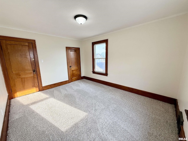1820 13th St, Rock Island, IL 61201 - unfurnished bedroom with carpet flooring and crown molding