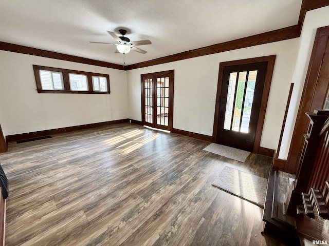 1820 13th St, Rock Island, IL 61201 - entryway with wood finished floors, ceiling fan, and crown molding