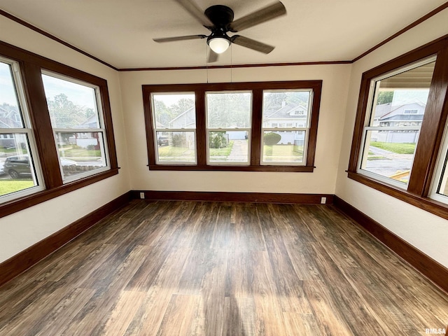 1820 13th St, Rock Island, IL 61201 - unfurnished room featuring plenty of natural light, dark wood finished floors, ornamental molding, and ceiling fan
