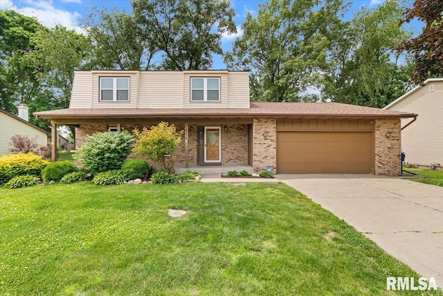 3611 75th St, Moline, IL 61265 - traditional home featuring brick siding, a garage, driveway, and a front yard