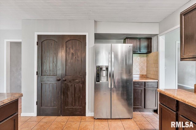 3611 75th St, Moline, IL 61265 - kitchen with stainless steel fridge with ice dispenser, decorative backsplash, dark brown cabinetry, and light tile patterned floors