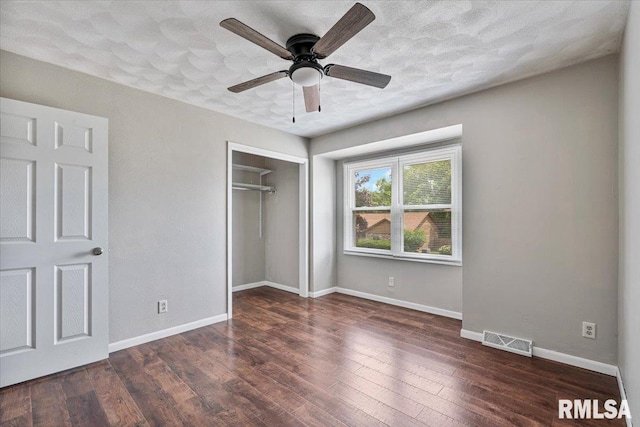 3611 75th St, Moline, IL 61265 - unfurnished bedroom with a closet, wood finished floors, a textured ceiling, and a ceiling fan