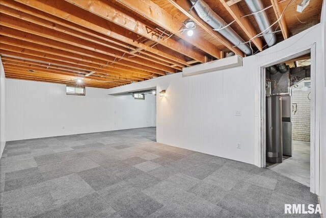 3611 75th St, Moline, IL 61265 - below grade area featuring water heater and carpet floors