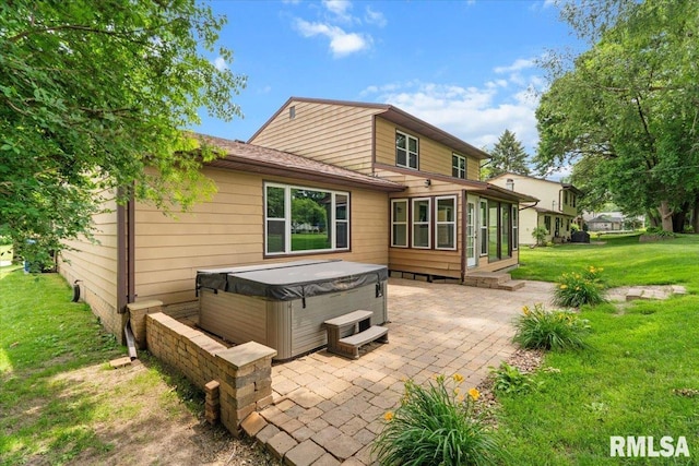 3611 75th St, Moline, IL 61265 - back of property with a hot tub, a patio area, a lawn, roof with shingles, and a sunroom