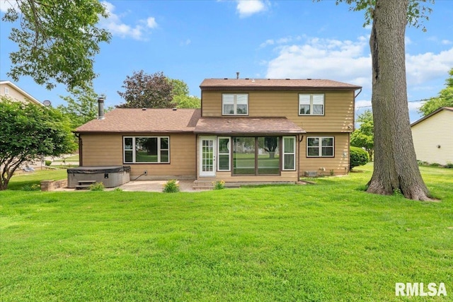 3611 75th St, Moline, IL 61265 - back of house featuring a hot tub, a patio area, and a yard