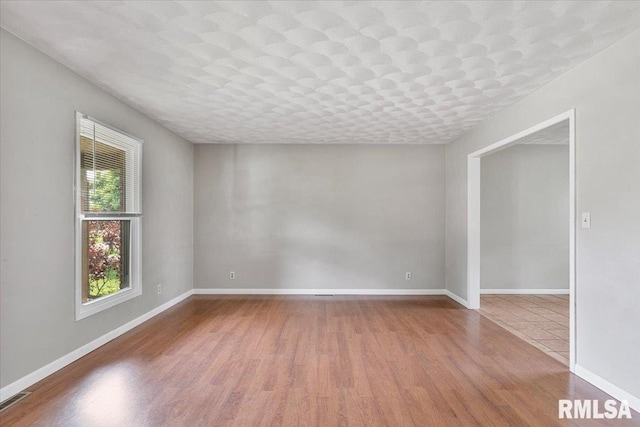 3611 75th St, Moline, IL 61265 - empty room featuring wood finished floors and baseboards