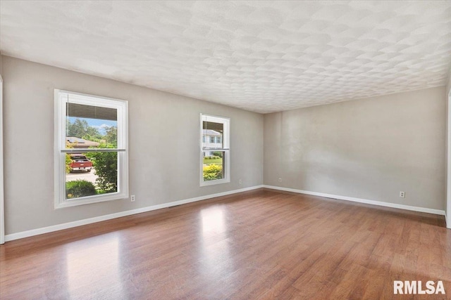 3611 75th St, Moline, IL 61265 - unfurnished room featuring wood finished floors and baseboards