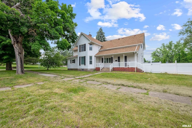 320 16th Ave N, Clinton, IA 52732 - back of property featuring covered porch, roof with shingles, and a chimney