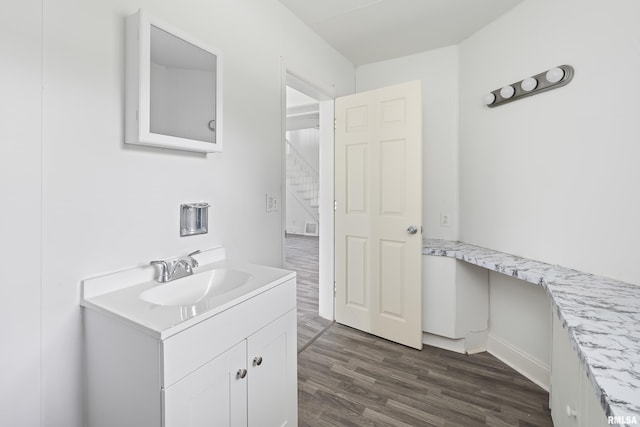 320 16th Ave N, Clinton, IA 52732 - bathroom featuring vanity and wood finished floors
