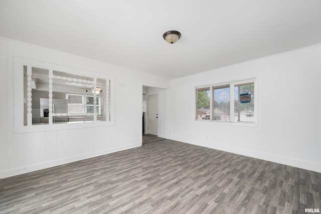320 16th Ave N, Clinton, IA 52732 - empty room featuring wood finished floors and baseboards