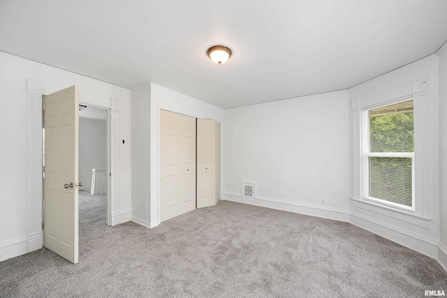 320 16th Ave N, Clinton, IA 52732 - unfurnished bedroom featuring carpet floors and a closet