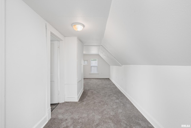 320 16th Ave N, Clinton, IA 52732 - bonus room featuring carpet floors and vaulted ceiling