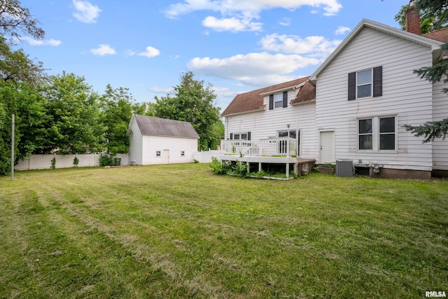 320 16th Ave N, Clinton, IA 52732 - back of property featuring a wooden deck, a chimney, and a shingled roof