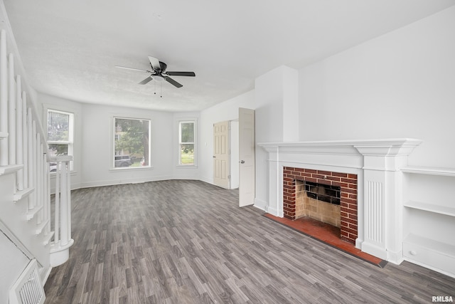 320 16th Ave N, Clinton, IA 52732 - unfurnished living room with a ceiling fan, wood finished floors, and plenty of natural light