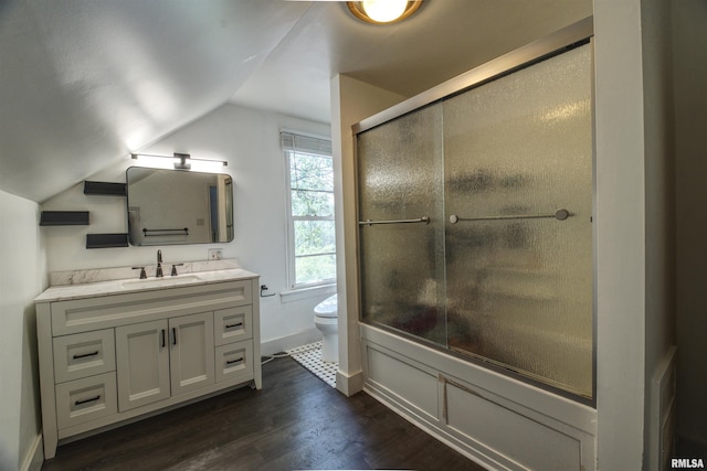 828 10th Ave, Fulton, IL 61252 - bathroom featuring vanity, vaulted ceiling, wood finished floors, and a shower with shower door