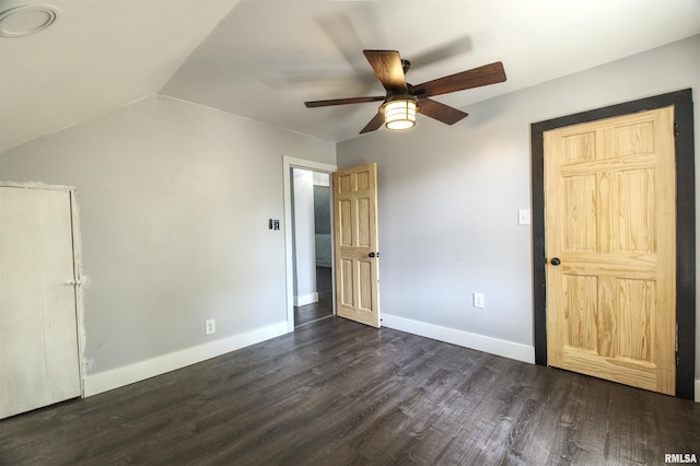 828 10th Ave, Fulton, IL 61252 - unfurnished bedroom with dark wood finished floors, vaulted ceiling, and ceiling fan