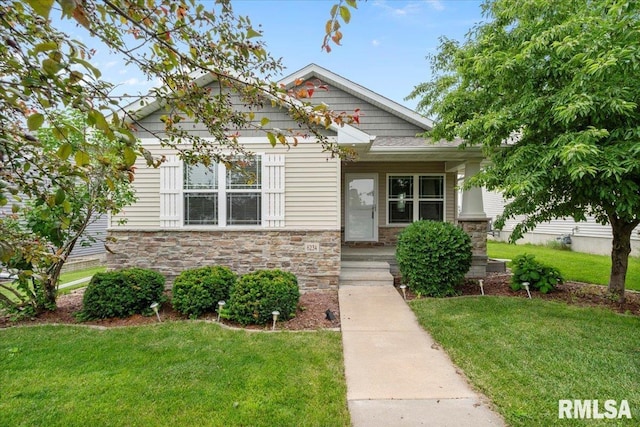 6234 Mississippi Ave, Davenport, IA 52807 - view of front facade featuring a front lawn and stone siding