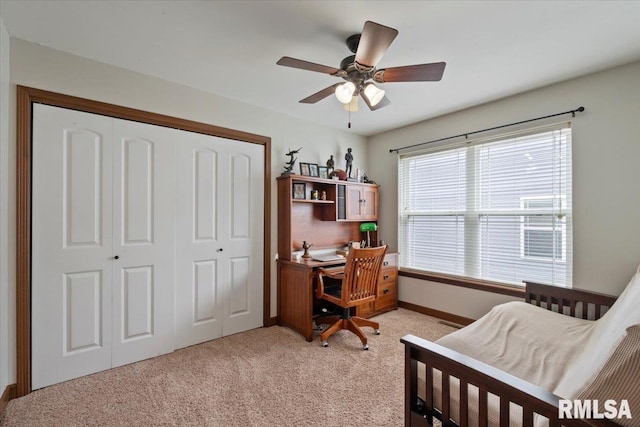 6234 Mississippi Ave, Davenport, IA 52807 - bedroom featuring a closet, light colored carpet, a desk, and ceiling fan