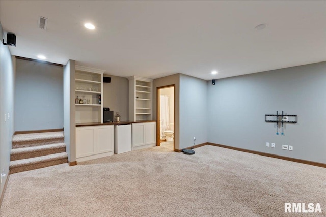 6234 Mississippi Ave, Davenport, IA 52807 - unfurnished living room featuring carpet, recessed lighting, and stairs