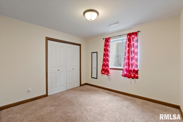 6234 Mississippi Ave, Davenport, IA 52807 - unfurnished bedroom with carpet flooring and a closet