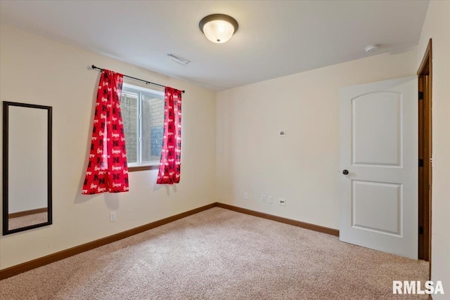 6234 Mississippi Ave, Davenport, IA 52807 - carpeted spare room featuring a smoke detector and baseboards