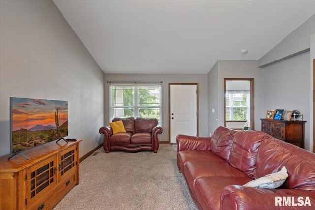 6234 Mississippi Ave, Davenport, IA 52807 - living area with vaulted ceiling, carpet, and healthy amount of natural light