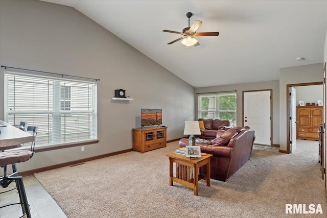 6234 Mississippi Ave, Davenport, IA 52807 - living area featuring light colored carpet, a ceiling fan, and high vaulted ceiling