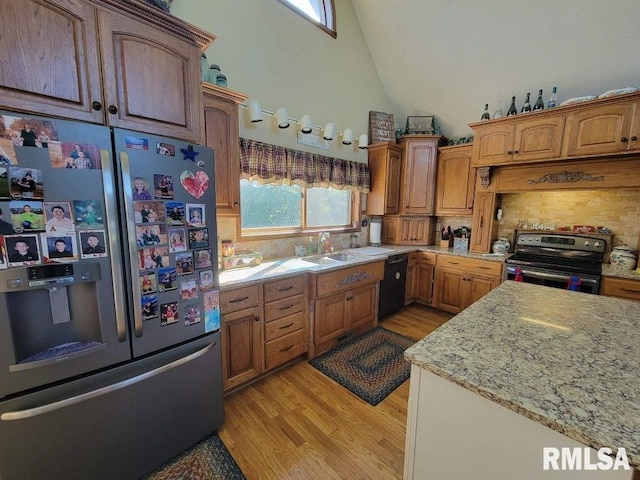 313 Double C Farm Ln, Dongola, IL 62964 - kitchen featuring stainless steel fridge, range with electric cooktop, black dishwasher, light wood-style flooring, and high vaulted ceiling