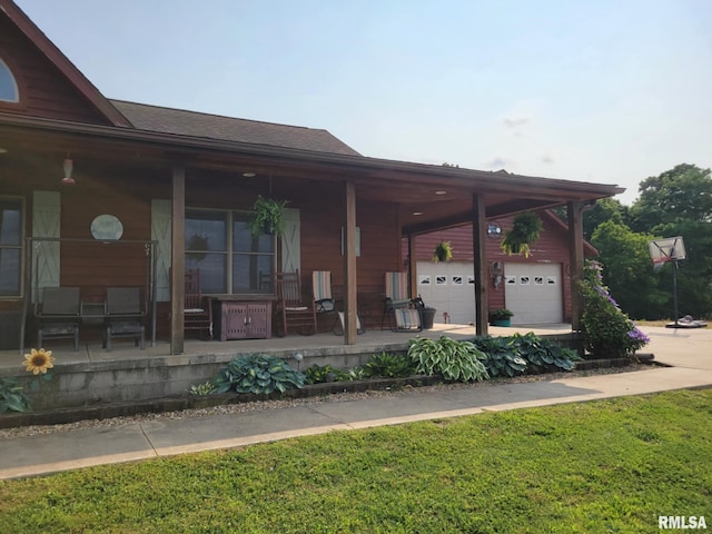 313 Double C Farm Ln, Dongola, IL 62964 - view of front of home with covered porch, a garage, and a front yard