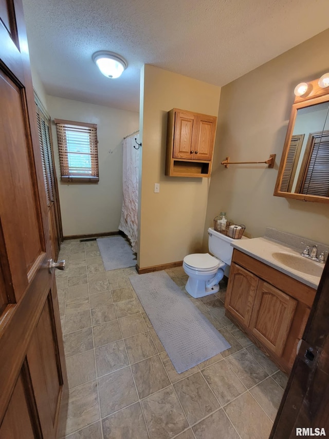 313 Double C Farm Ln, Dongola, IL 62964 - bathroom featuring vanity, a textured ceiling, and tile patterned floors