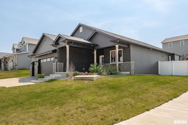 3812 Joyce Ln, Davenport, IA 52806 - view of front of home with stone siding, driveway, and a garage