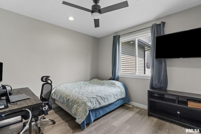 3812 Joyce Ln, Davenport, IA 52806 - bedroom with wood finished floors, a desk, a ceiling fan, and recessed lighting