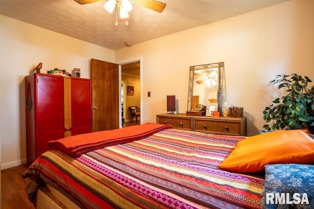 705 S Hadfield St, Marion, IL 62959 - bedroom with wood finished floors and ceiling fan