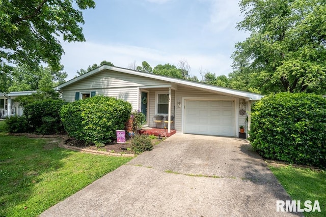 705 S Hadfield St, Marion, IL 62959 - ranch-style house with driveway, a garage, and a front lawn