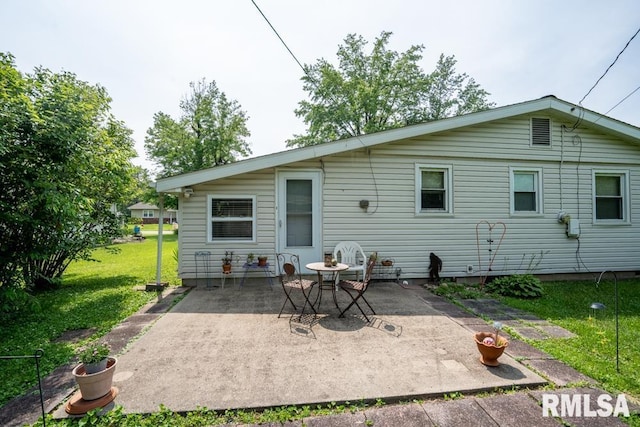 705 S Hadfield St, Marion, IL 62959 - rear view of house featuring a patio area and a lawn